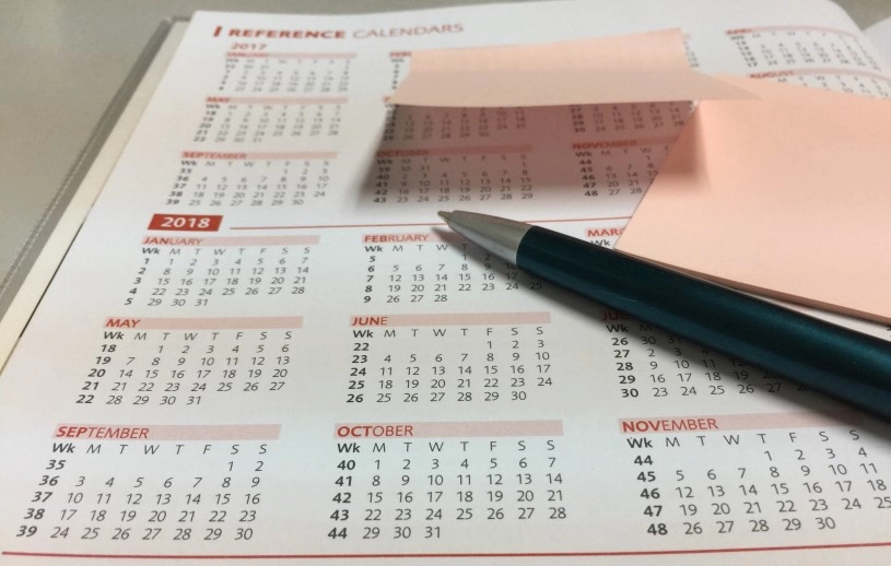 a pen on a calendar