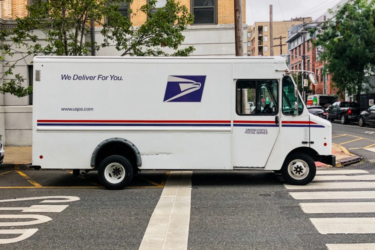 usps truck driving down the street