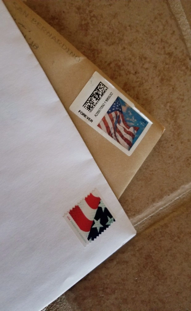 forever stamp on an envelope