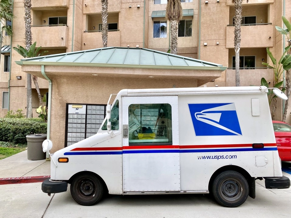 usps truck in front of building