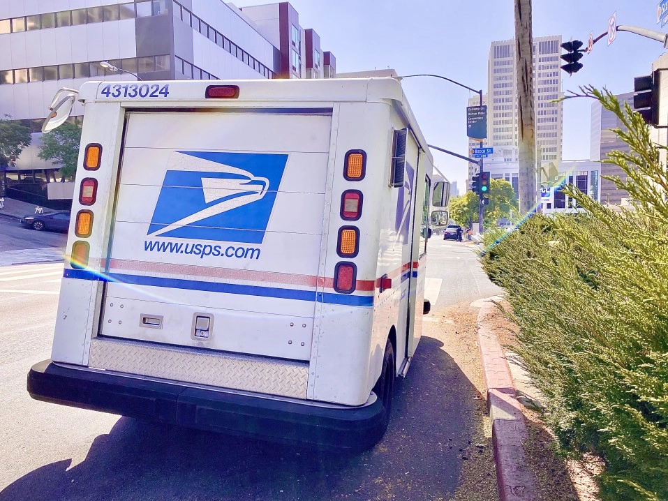 usps truck driving on the road