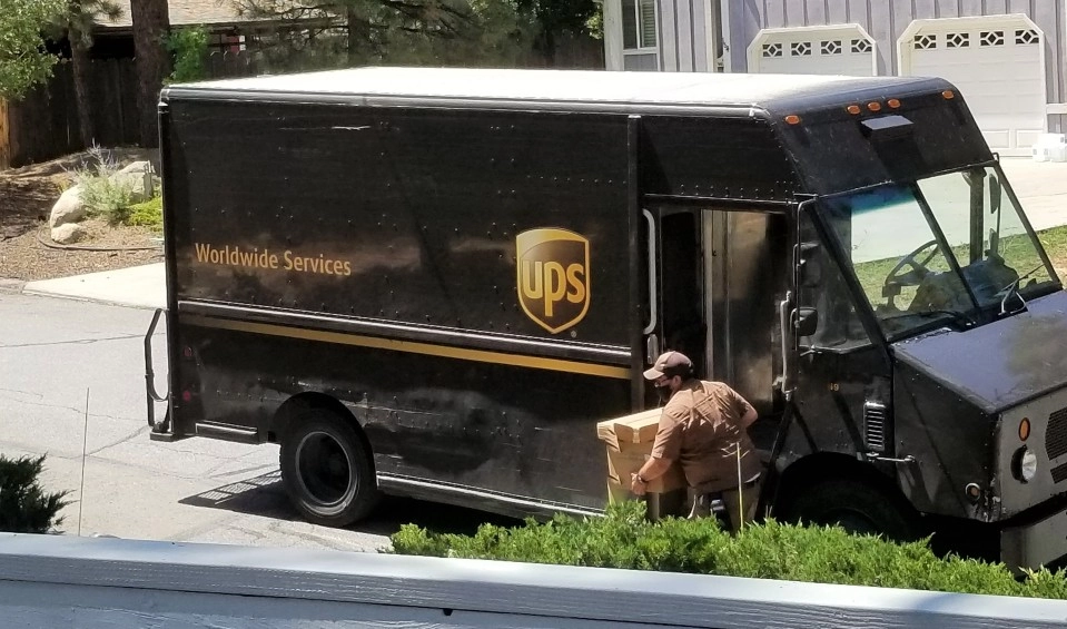 ups worker delivering a package