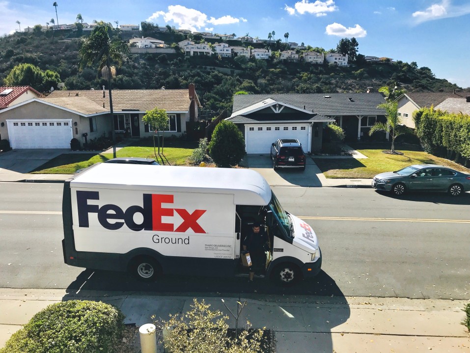 fedex truck delivering packages