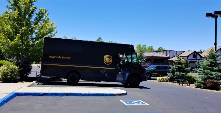 ups driving on a street