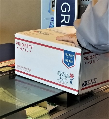 priority mail package being shipped