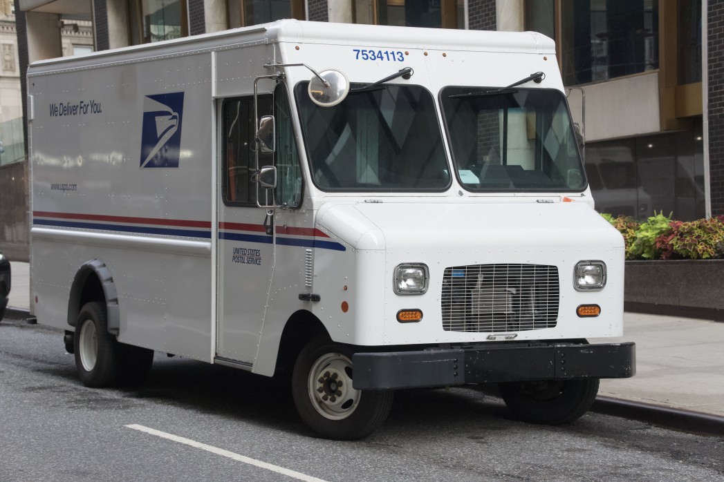 usps truck driving on the road